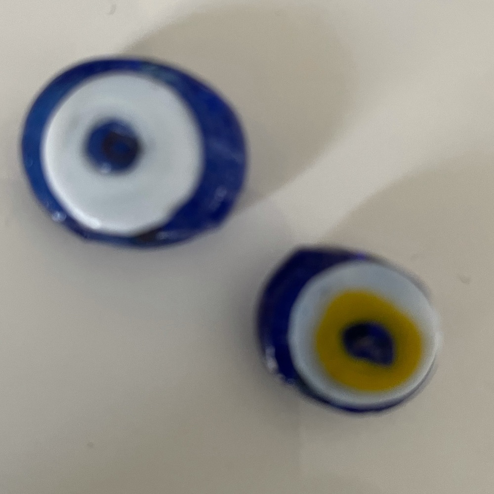 2 glass evil eye beads